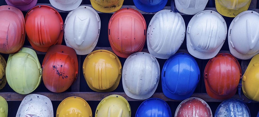 Wall of different colored Hard Hats