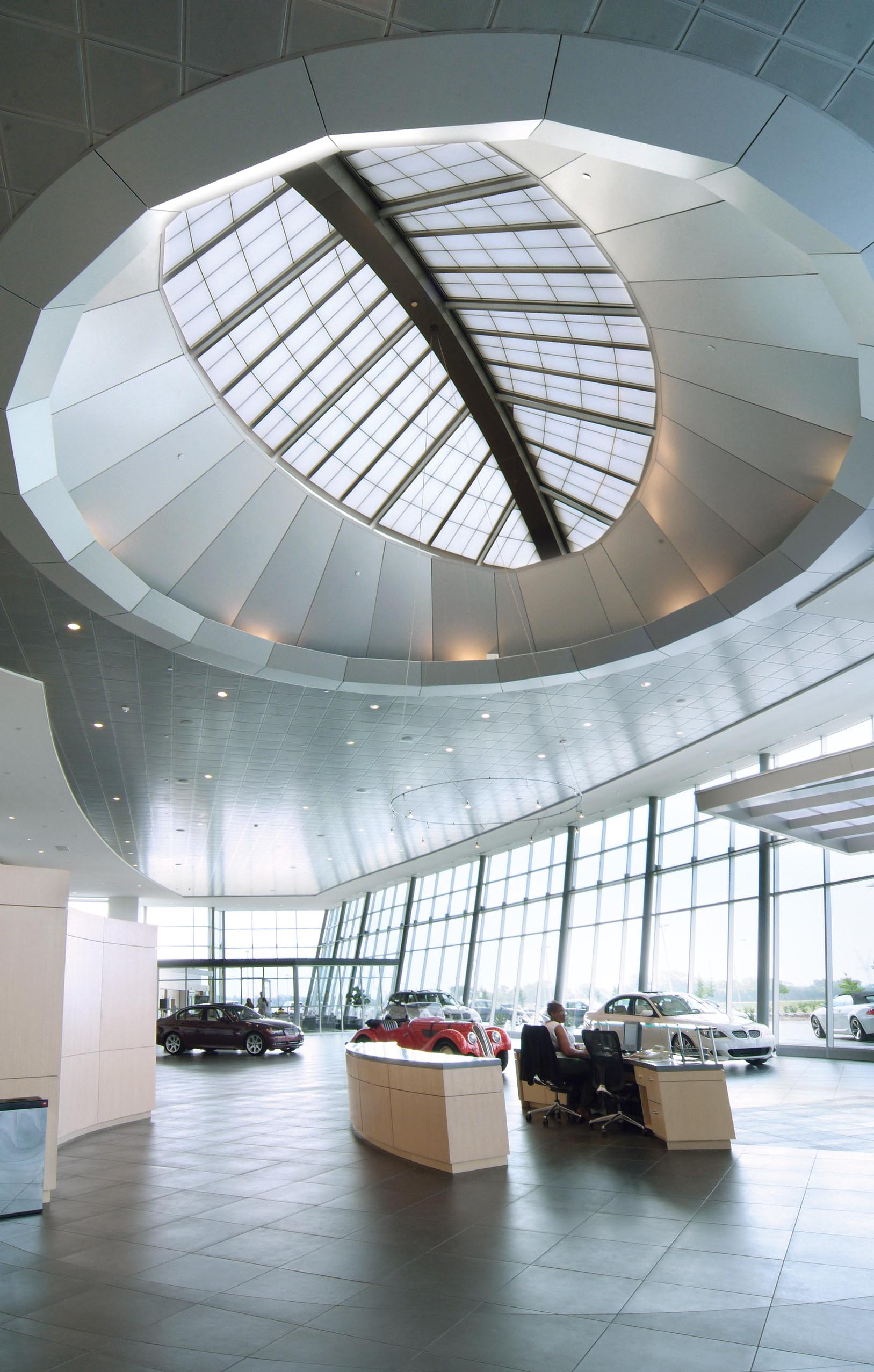 Luxury car dealerships attract with color, comfort and convenience